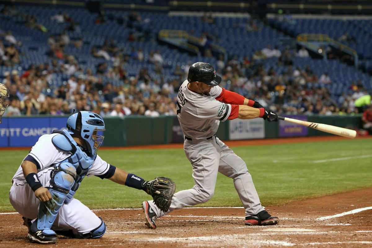 St. Petersburg, FL, USA; Boston Red Sox right fielder Cody Ross (7) hits an RBI double int he sixth inning against the Tampa Bay Rays at Tropicana Field. Mandatory Credit: Kim Klement-US PRESSWIRE
