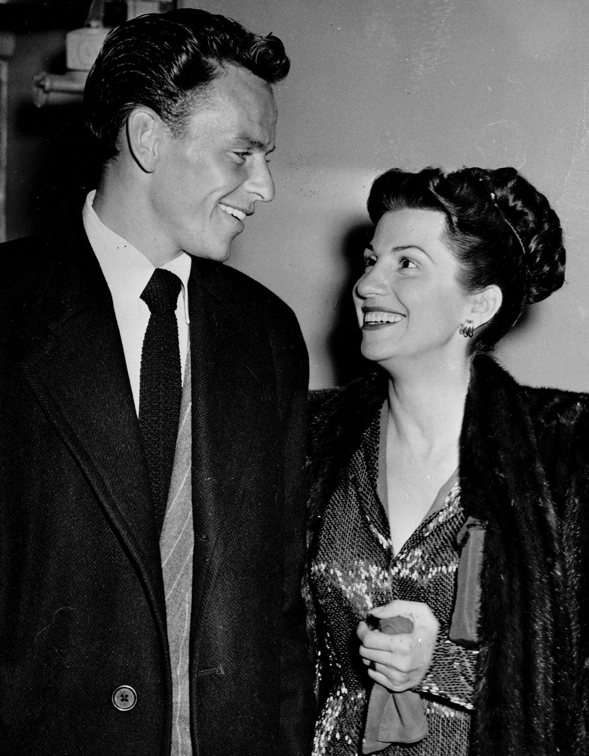 In this Oct. 23, 1946 file photo, singer Frank Sinatra and his wife Nancy smile broadly as they leave a Hollywood night club. Nancy died Friday, July 13, 2018. | AP Photo/File