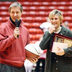 FILE - Elliott, University of Utah basketball coach, is recognized by Chris Hill on Jan 18, 2007 for her 500 wins as a coach.   