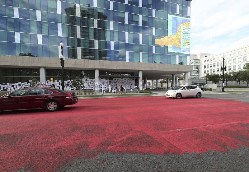 Family and friends of Bernardo Palacios-Carbajal painted the street red in protest in front of the Salt Lake County District Attorney’s Office in Salt Lake City on Saturday, June 27, 2020. Palacios-Carbajal was shot and killed while fleeing police in May.