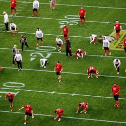 The Utah Utes stretch as they and the Indiana Hoosiers prepare to play in the Foster Farms Bowl in Santa Clara, California on Wednesday, Dec. 28, 2016.