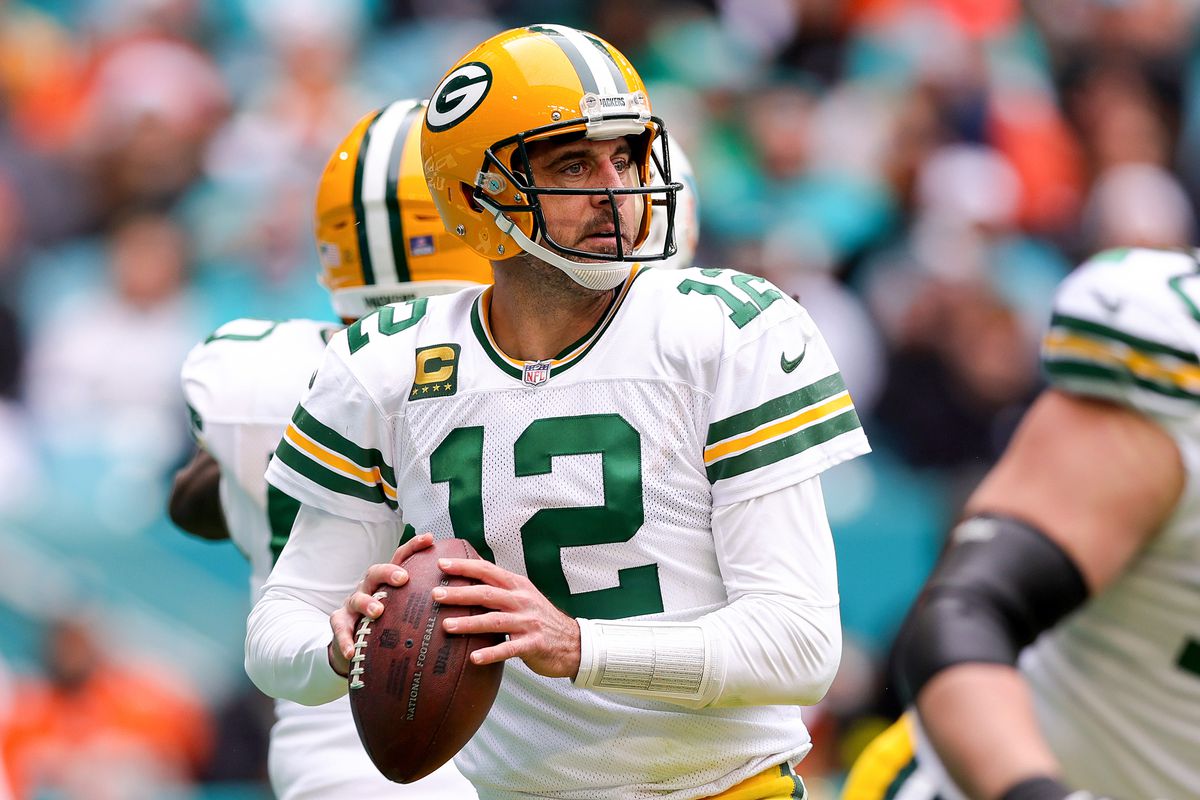 Aaron Rodgers #12 of the Green Bay Packers looks to pass against the Miami Dolphins during the first half of the game at Hard Rock Stadium on December 25, 2022 in Miami Gardens, Florida.