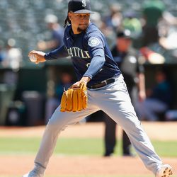 OAKLAND, CALIFORNIA - AUGUST 21: Luis Castillo #21 of the Seattle Mariners pitches in the bottom of the first inning. against the Oakland Athletics at RingCentral Coliseum on August 21, 2022 in Oakland, California.