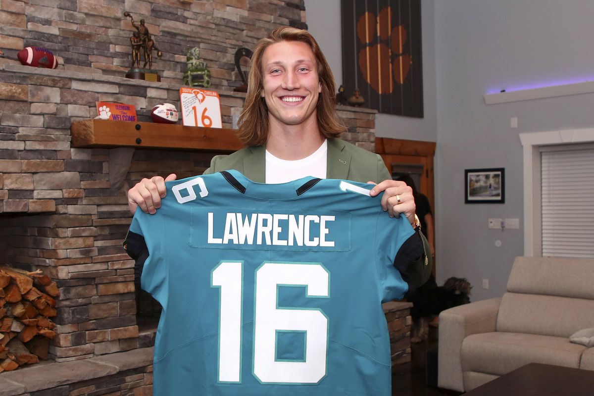 In this handout photo provided by the National Football League, quarterback Trevor Lawrence poses after being selected with the first overall pick by the Jacksonville Jaguars in the 2021 NFL Draft on April 29, 2021 in Seneca, South Carolina.