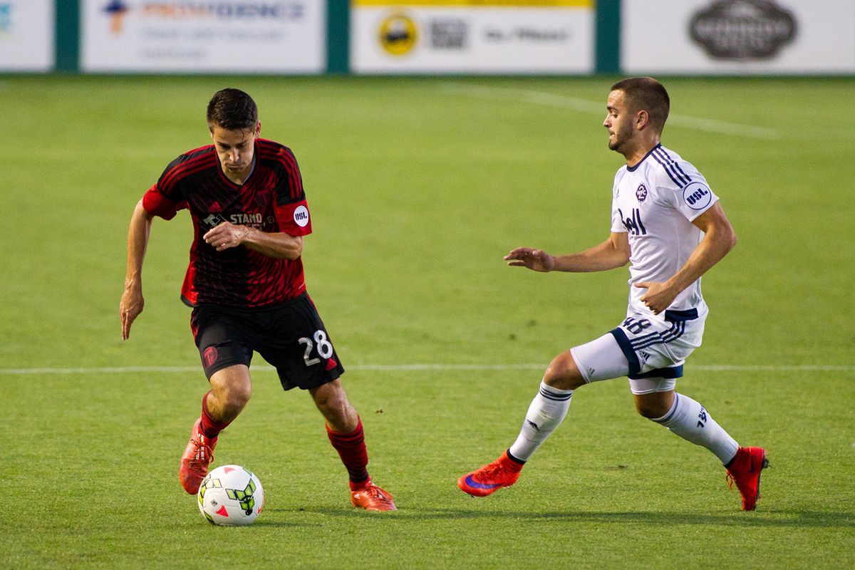 Victor Blasco (R) challenges Portland's Andy Thoma (L) for the ball.  Timbers FC2 defeated WFC2 by a score of 3-1.