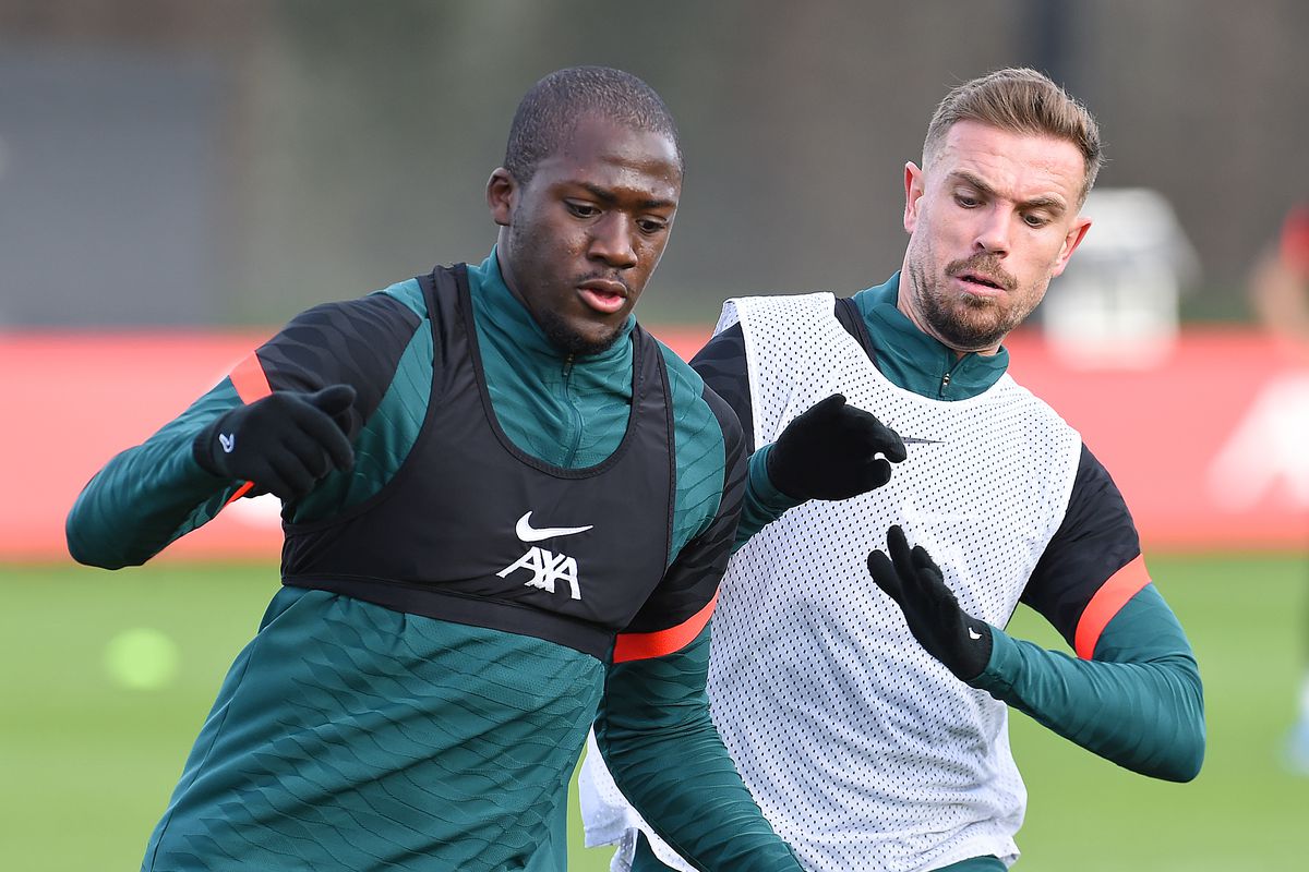 &nbsp;Ibrahima Konate and Jordan Henderson captain of Liverpool during a training session at AXA Training Centre on February 11, 2022 in Kirkby, England.