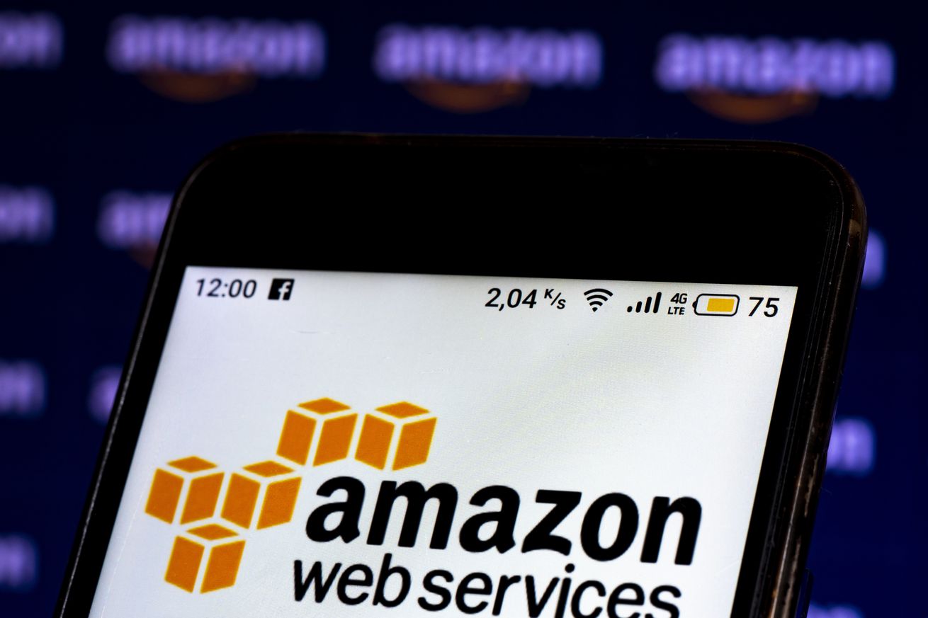 In this photo illustration an Amazon Web Services logo seen...