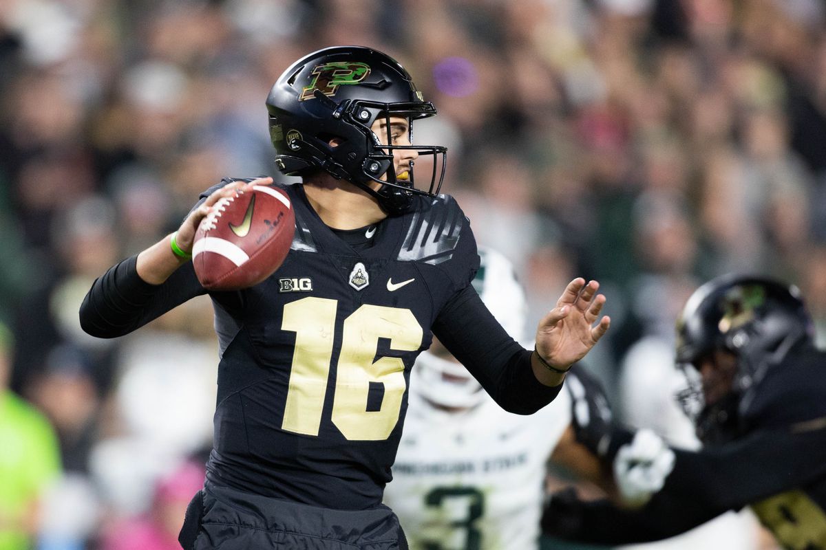 Purdue Boilermakers quarterback Aidan O’Connell (16) drops back to pass the ball in the second half against the Michigan State Spartans at Ross-Ade Stadium