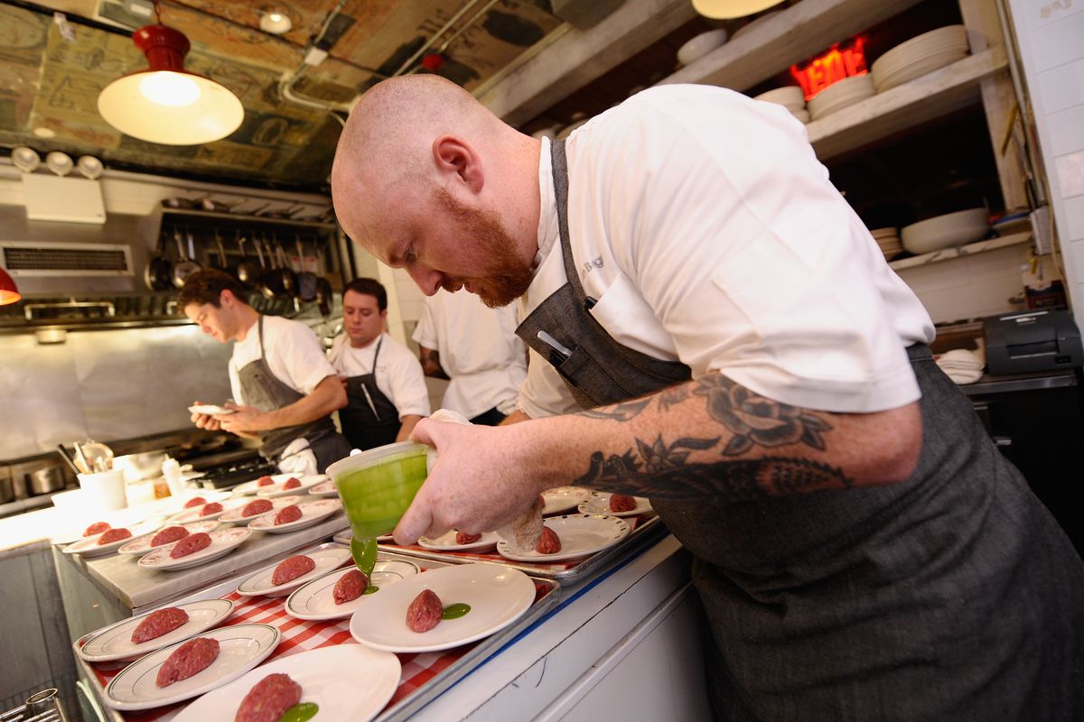 Bogle plating a dish for an event at the Food Network NYC Wine & Food Festival, October 16, 2014.
