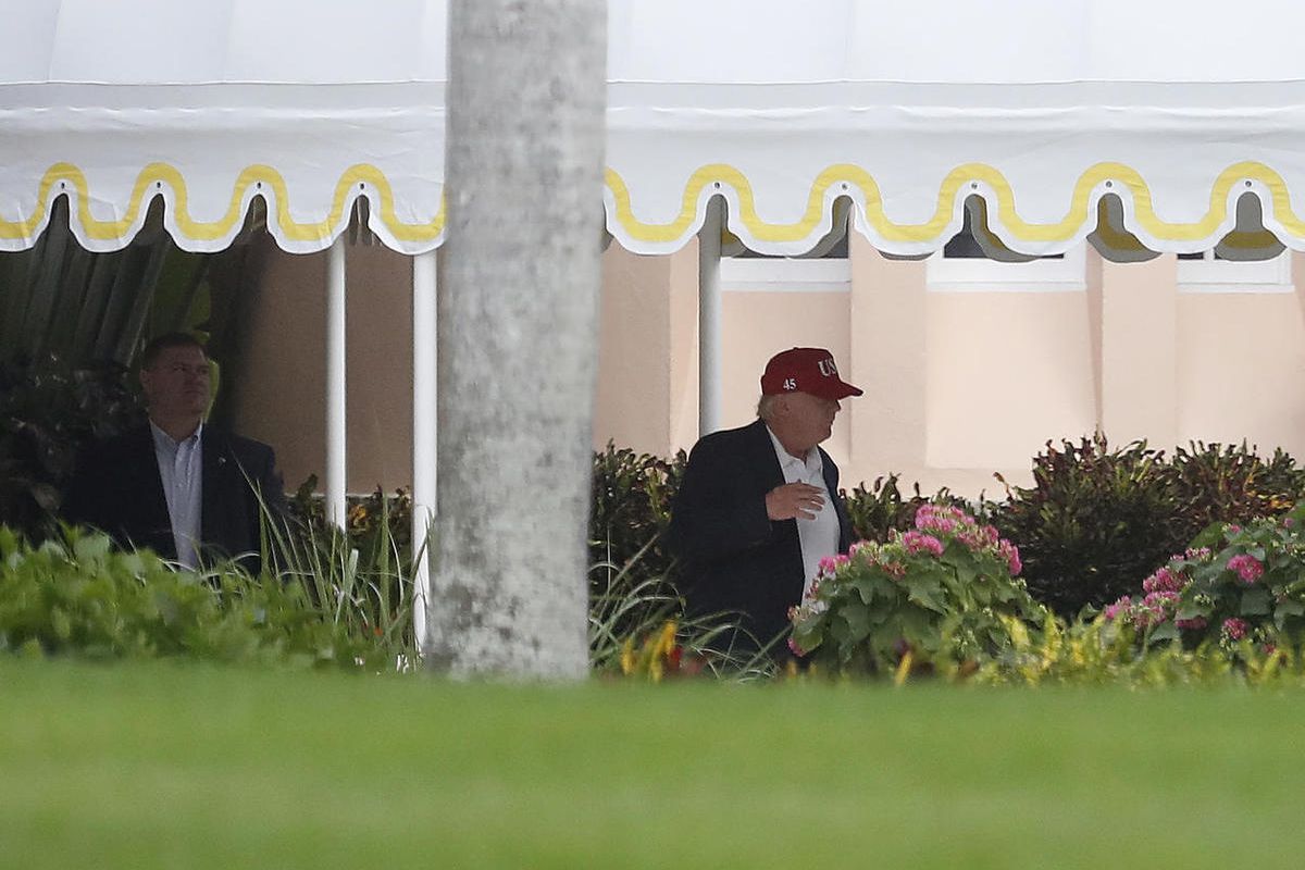 President-elect Donald Trump walks to his motorcade vehicle at Mar-A Lago, Sunday, Nov. 27, 2016, in Palm Beach, Fla., en route to Palm Beach International Airport and onto New York.