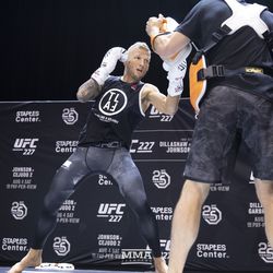 T.J. Dillashaw throws an uppercut at the UFC 227 open workouts in Los Angeles, California.