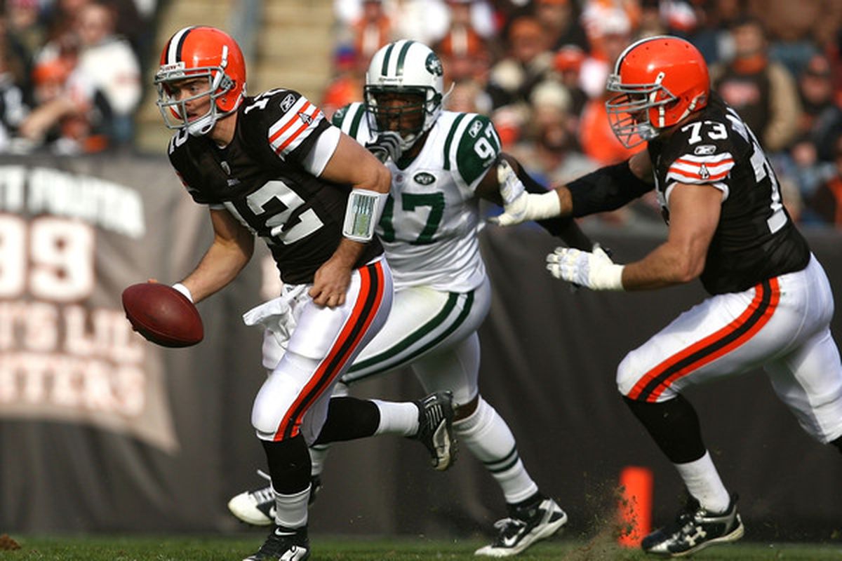 CLEVELAND - NOVEMBER 14:  Quarterback Colt McCoy #12 of the Cleveland Browns runs away from linebacker Calvin Pace #97 of the New York Jets at Cleveland Browns Stadium on November 14 2010 in Cleveland Ohio.  (Photo by Matt Sullivan/Getty Images)