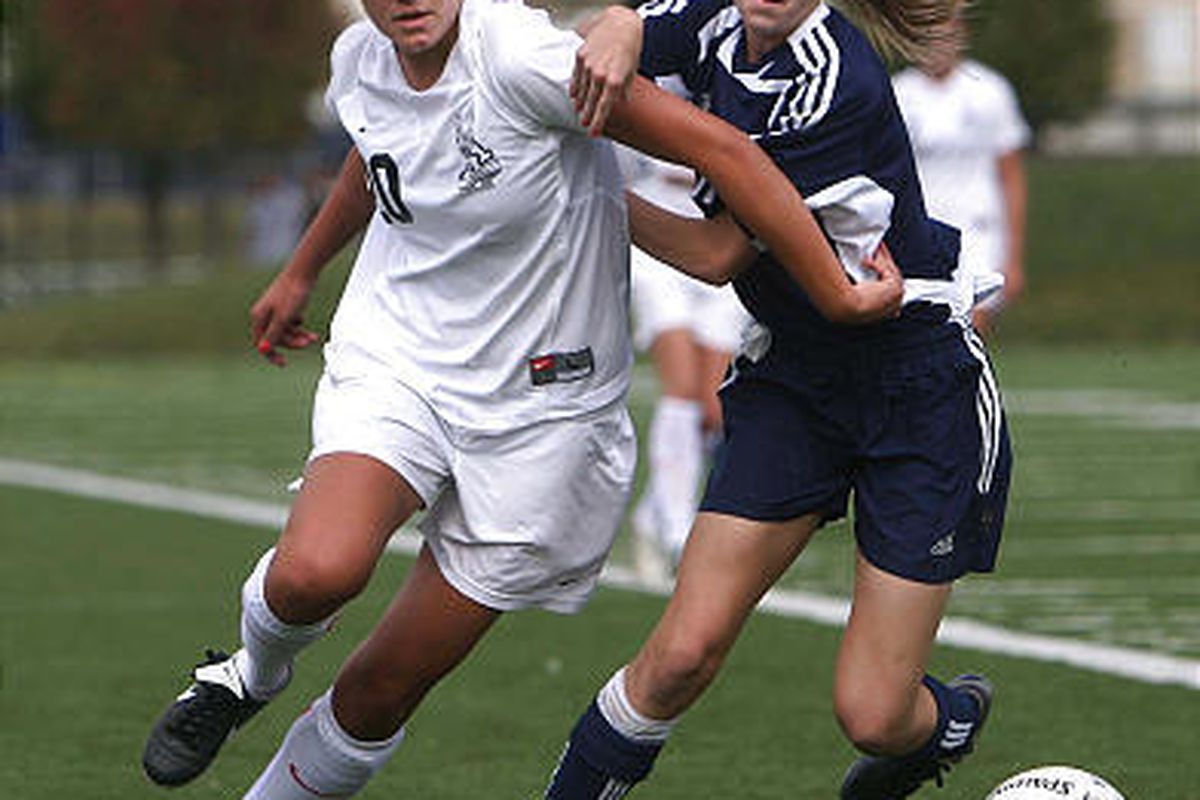 Alta's Summer Tillotson, left, and Timpanogos' Courtney Hollan battle for the ball during Tuesday's state semifinal game.