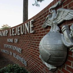 This Dec. 2, 2005 file photo shows cars entering the main gate at Camp Lejeune in Jacksonville, N.C. 