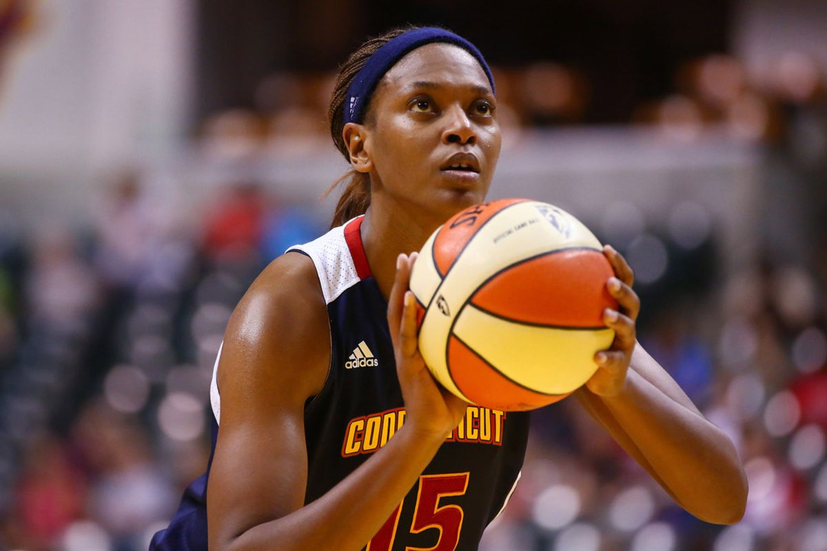 June 21, 2012; Indianapolis, IN, USA; Connecticut Sun forward Asjha Jones (15) shoots a free throw against the Indiana Fever at Bankers Life Fieldhouse. Indiana defeated Connecticut 95-61. Mandatory credit: Michael Hickey-US PRESSWIRE