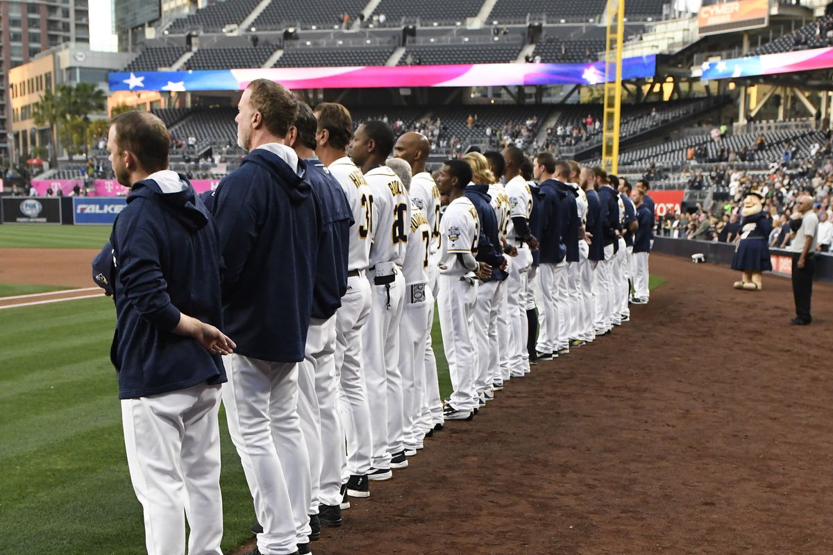 SAN DIEGO, CALIFORNIA - MAY 2: San Diego Padres players line up for the national anthem before a baseball game against the Colorado Rockies at PETCO Park on May 2, 2016 in San Diego, California. 