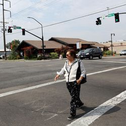Ligaya Dela Cruz crosses the intersection of 900 East and 2100 South in Salt Lake City.  Eight crashes between pedestrians and vehicles have occurred here, making it one of the 10 intersections with the most auto-pedestrian accidents in Salt Lake County and Utah County, based on data from 2010-2016, on Tuesday, Aug. 8, 2017.