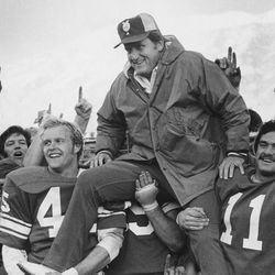 BYU head football coach LaVell Edwards is carried after beating Utah 48-20 Nov. 25, 1974.