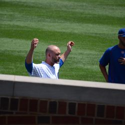 12:51 p.m. Catcher David Ross loosening up, before the game - 