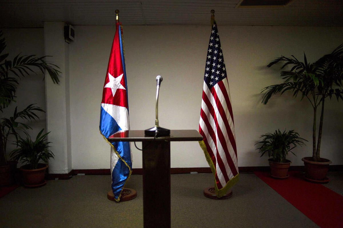 In this Jan. 22, 2015 file photo, Cuban and U.S. flags stand before the start of a press conference on the sidelines of talks between the two nations in Havana, Cuba. Members of the U.S. Democratic congressional delegation to Cuba said on Tuesday, Feb. 17