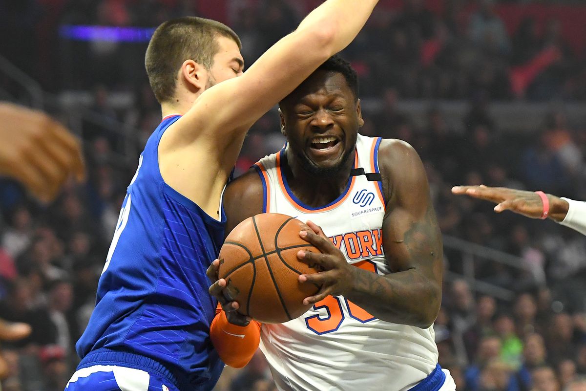 Los Angeles Clippers center Ivica Zubac guards New York Knicks forward Julius Randle as he drives to the basket in the first quarter of the game at Staples Center.