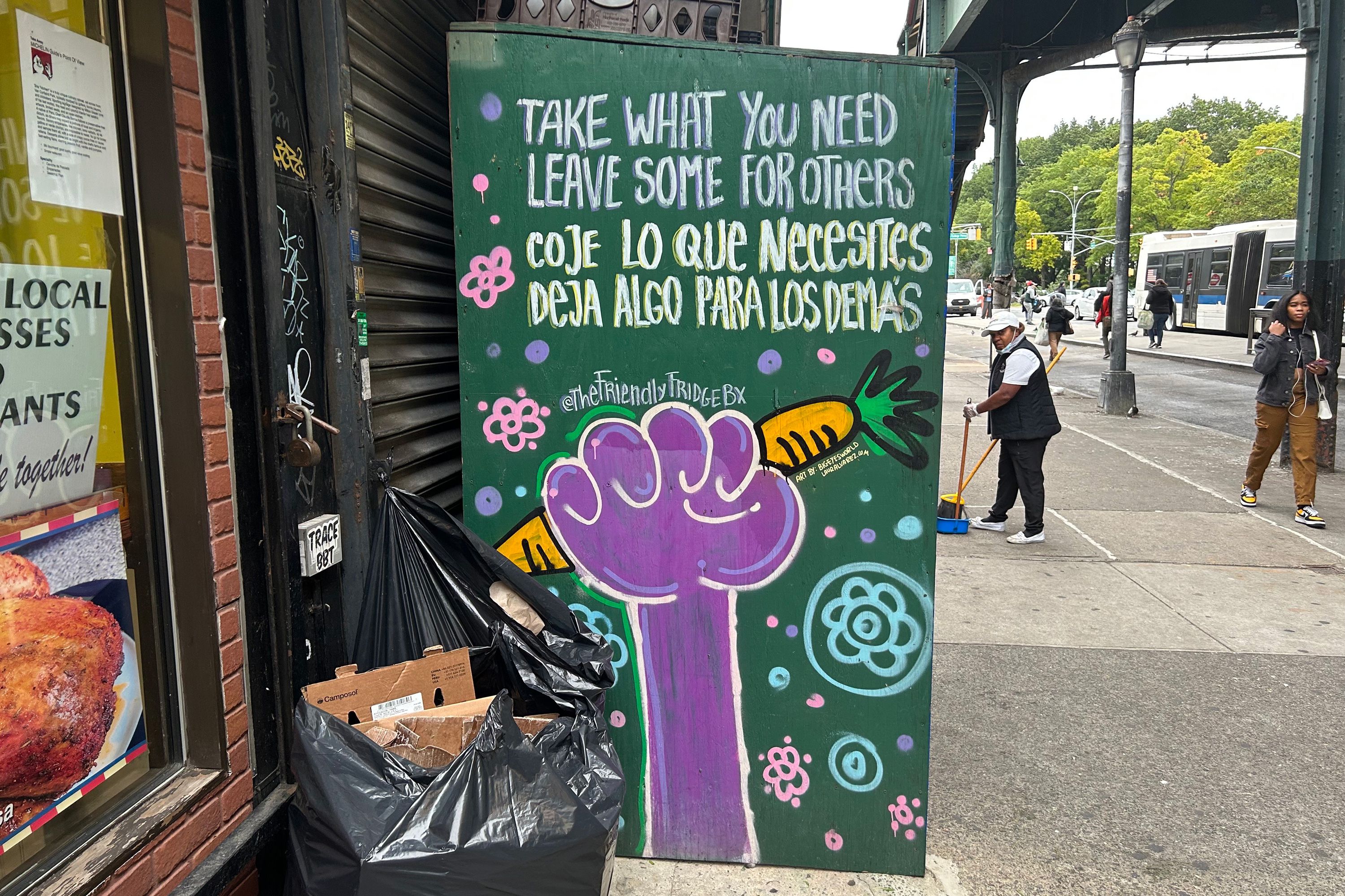 “Take What You Need, Leave Some For Others” was painted on the side of a community fridge in Riverdale.