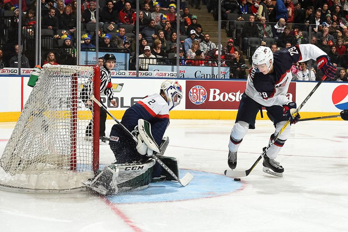 USA's Tage Thompson #29 deke's out Slovakia's Matej Tomek #2 and would score during the second period of playing a preliminary round game at the 2017 IIHF World Junior Championship.