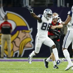 Dallas Cowboys wide receiver Dez Bryant (88) celebrates with teammate Brice Butler (19) after catching an 8-yard touchdown pass during the second half of an NFL football game against the Minnesota Vikings on Thursday, Dec. 1, 2016, in Minneapolis. 