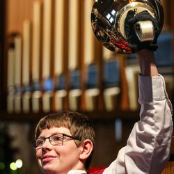 Barrett Carpenter, 14, performs with The Wesley Bell Ringers at Christ United Methodist Church in Salt Lake City on Sunday, Dec. 16, 2018.