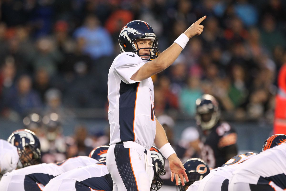 Aug 9, 2012; Chicago, IL, USA; Denver Broncos quarterback Peyton Manning (18) signals against the Chicago Bears at Soldier Field.  Mandatory Credit: Matthew Emmons-US PRESSWIRE
