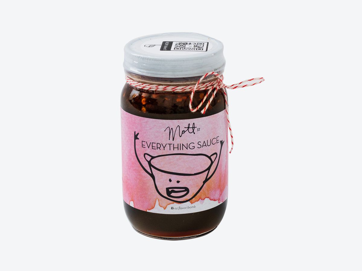A jar of dark sauce with a label that reads “Mott St Everything Sauce”