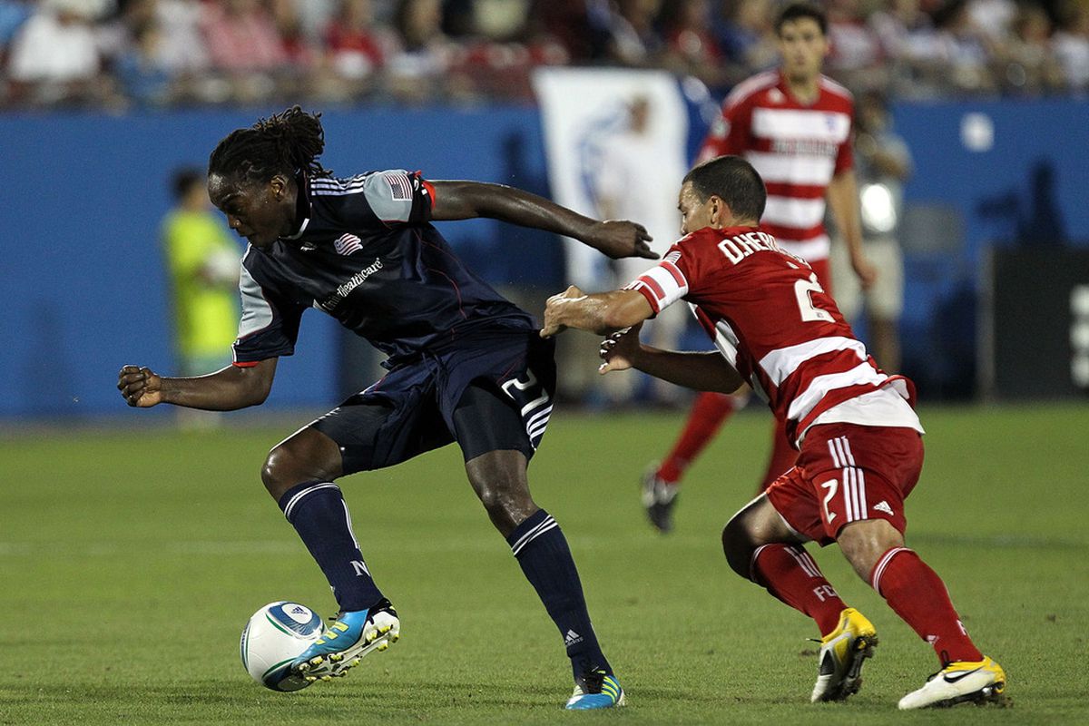FRISCO, TX - JUNE 04:  Shalrie Joseph #21 of the New England Revolution dribbles the ball against Daniel Hernandez #2 of the FC Dallas at Pizza Hut Park on June 4, 2011 in Frisco, Texas.  (Photo by Ronald Martinez/Getty Images)