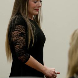 Vanessa MacNeill leaves the courtroom after testifying at the trial of her father, Martin MacNeill, at 4th District Court in Provo Wednesday, Oct. 30, 2013. Martin MacNeill is charged with murder for allegedly killing his wife, Michele MacNeill, in 2007.