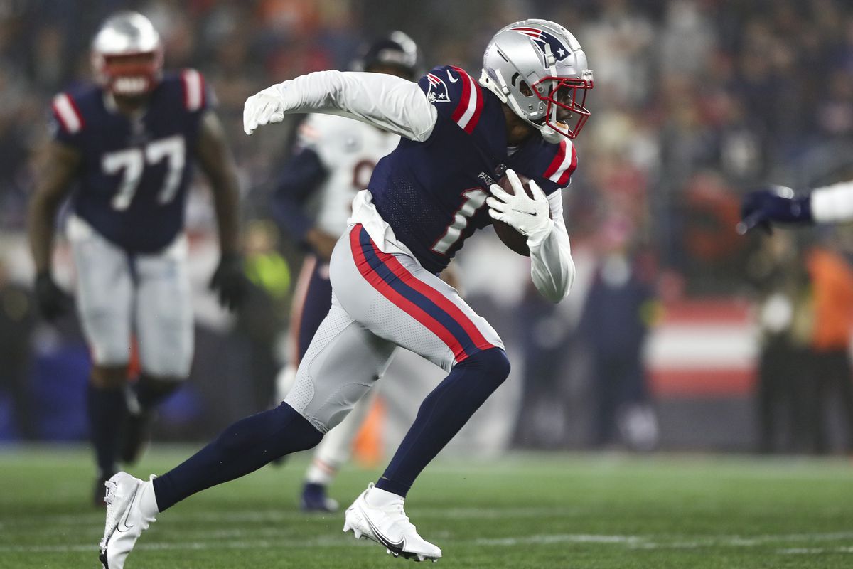 DeVante Parker #1 of the New England Patriots carries the ball after completing a catch during an NFL football game against the Chicago Bears at Gillette Stadium on October 24, 2022 in Foxborough, Massachusetts.