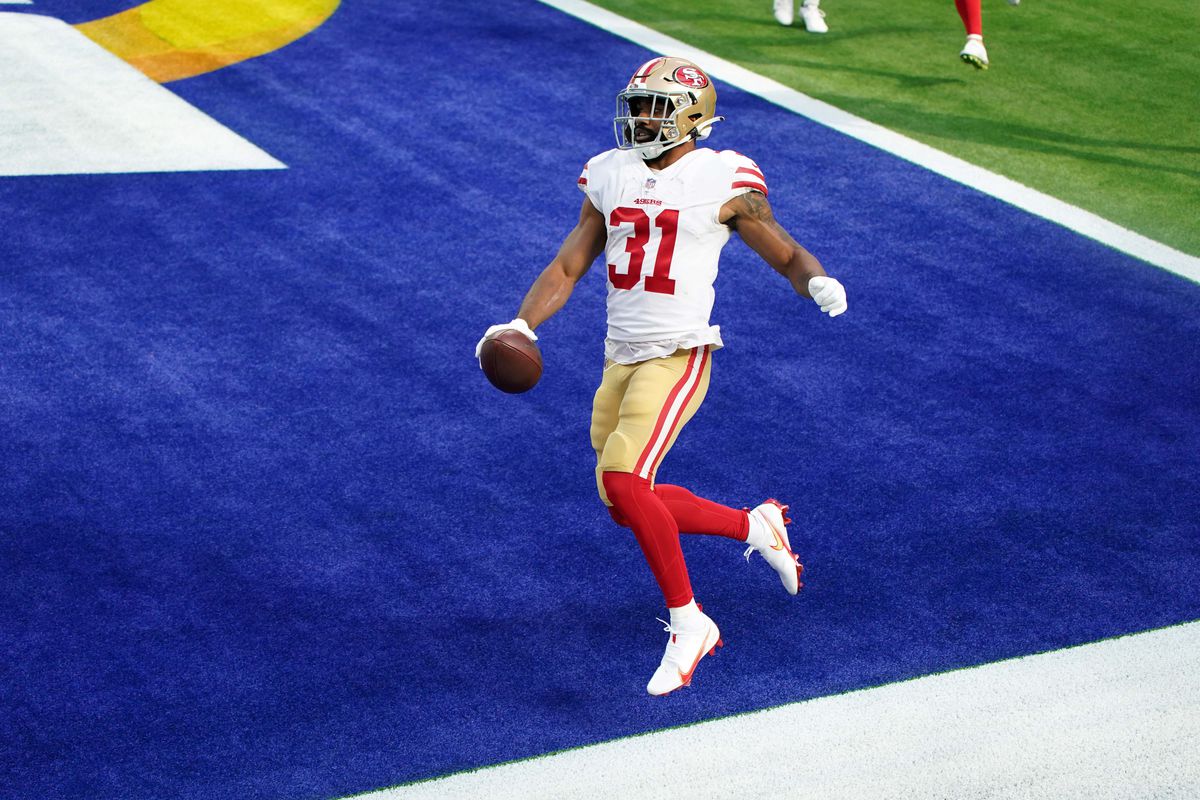 San Francisco 49ers running back Raheem Mostert (31) scores an 8-yard touchdown run in the first quarter against the Los Angeles Rams at SoFi Stadium.