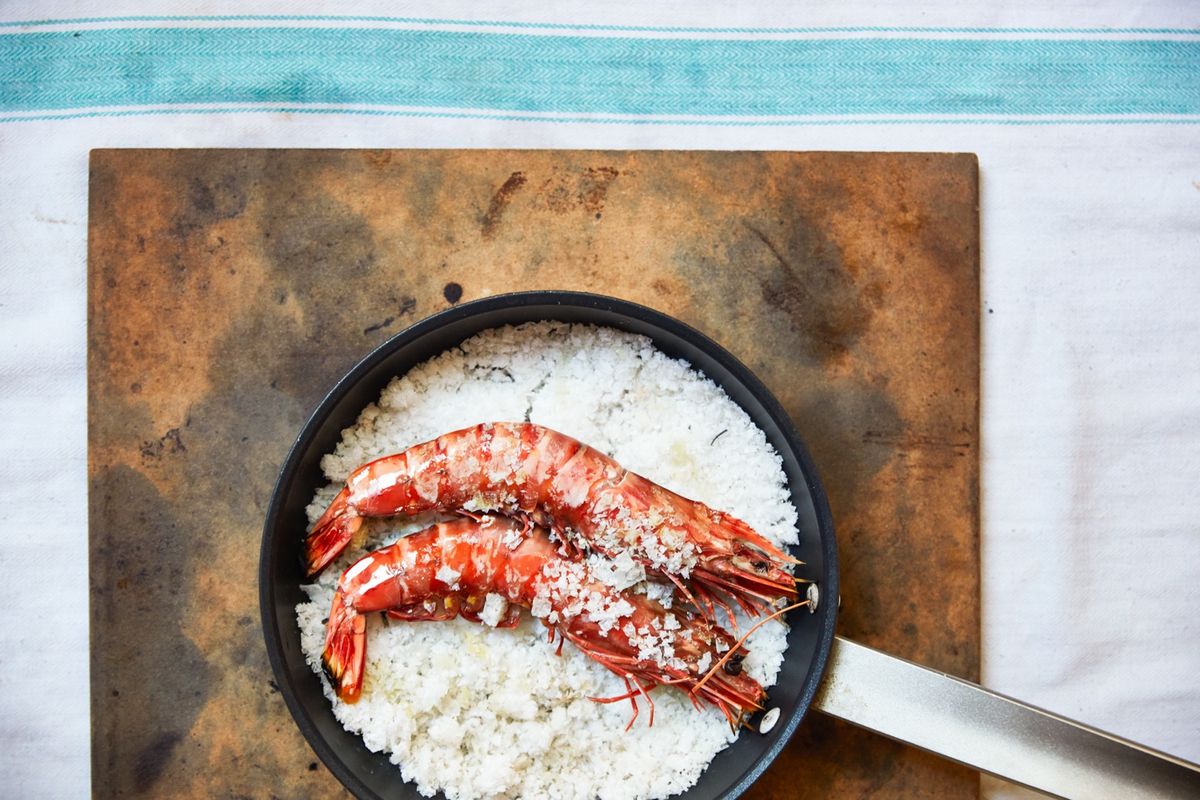 A red prawn duo on salt in a pan, for Claro Portuguese restaurant in Soho
