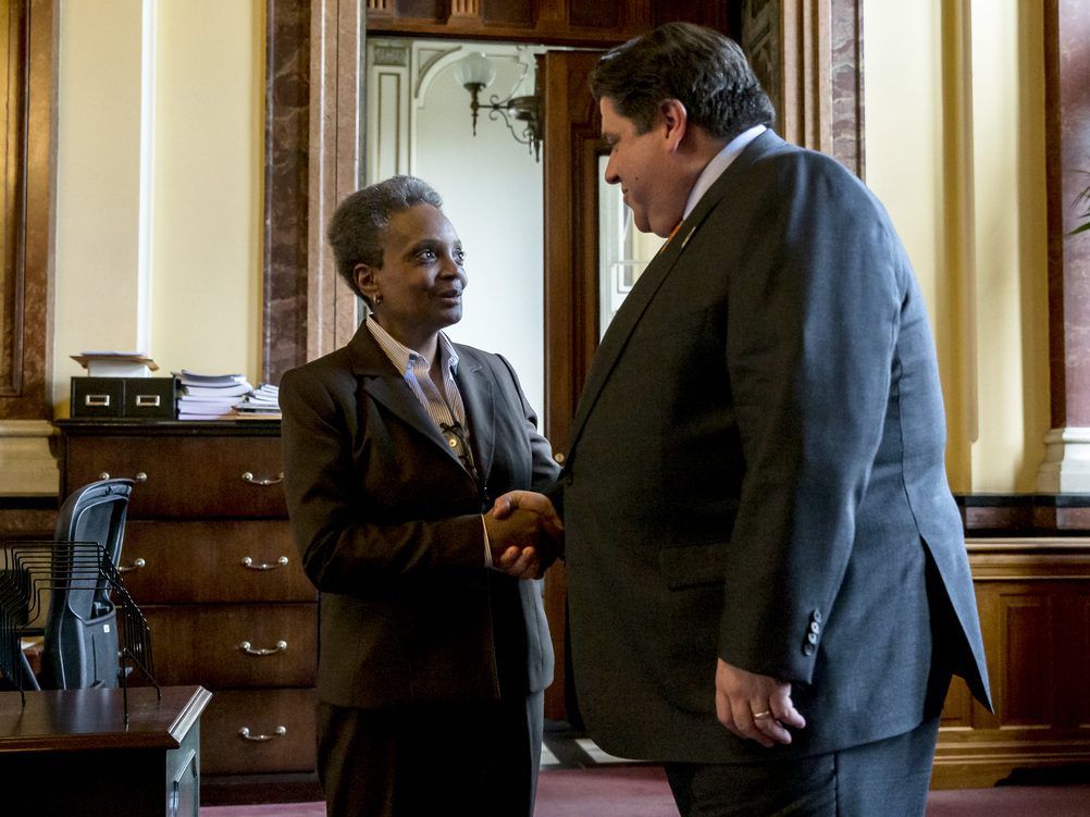 Mayor-elect Lori Lightfoot shakes hands with Gov. J.B. Pritzker after a meeting in his offices at the Illinois State Capitol in Springfield.