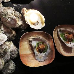 Ashley Christensen's Oysters with creamed turnips, bacon-fat poached oysters, roasted tomato, and Carolina cheddar-cornbread crumbs.