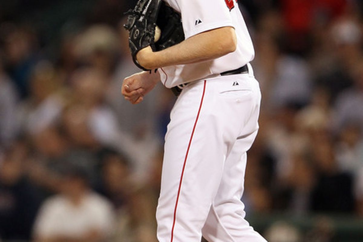 BOSTON, MA - Mark Melancon #37 of the Boston Red Sox reacts after he gave up a home run to Josh Hamilton of the Texas Rangers at Fenway Park in Boston, Massachusetts.  (Photo by Elsa/Getty Images)