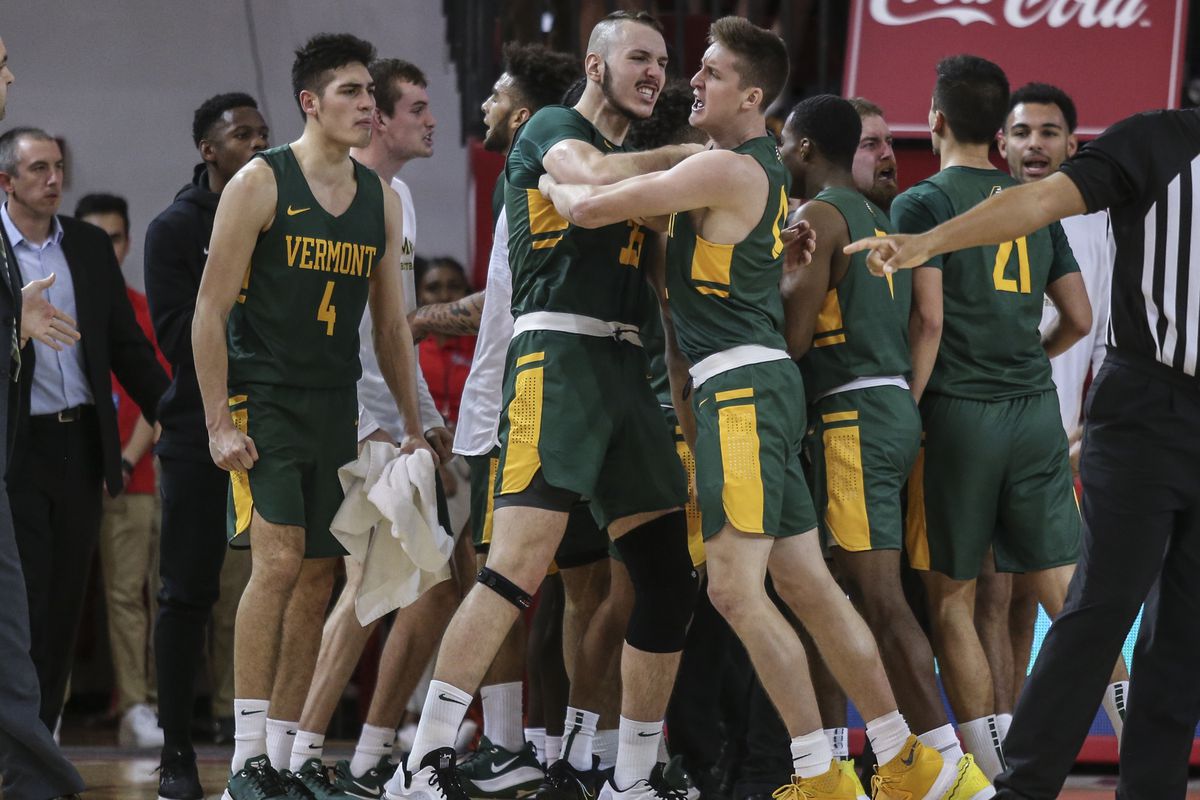 Vermont Catamounts forwards Ryan Davis (35) and Bailey Patella (12) celebrate during a victory over the St. John’s Red Storm at Carnesecca Arena.