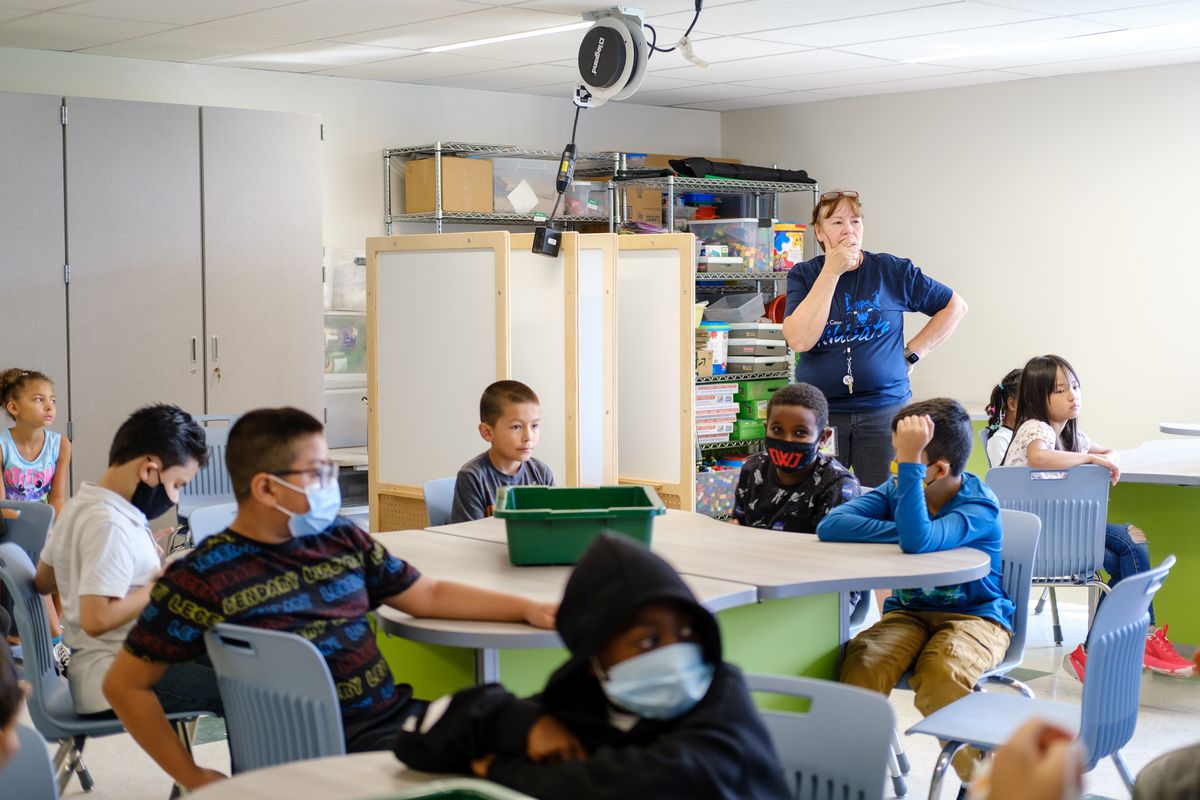 A teacher leads her students in a classroom discussion during a STEM class.