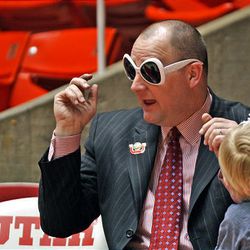 Utah coach Jim Boylen clowns with his daughters Layla (left) and Ashlen after the game as the University of Utah defeats Wyoming 74-64.