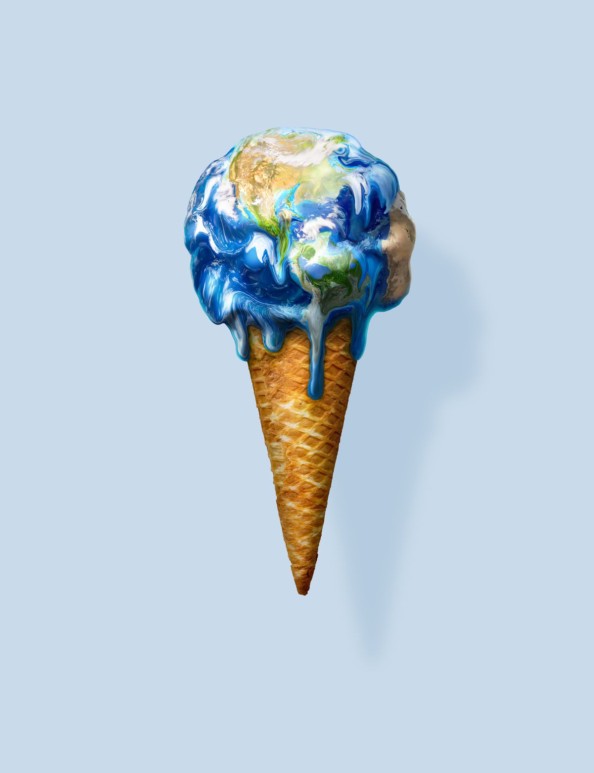 Stock photo of melting ice cream cone colored to look like the planet Earth.