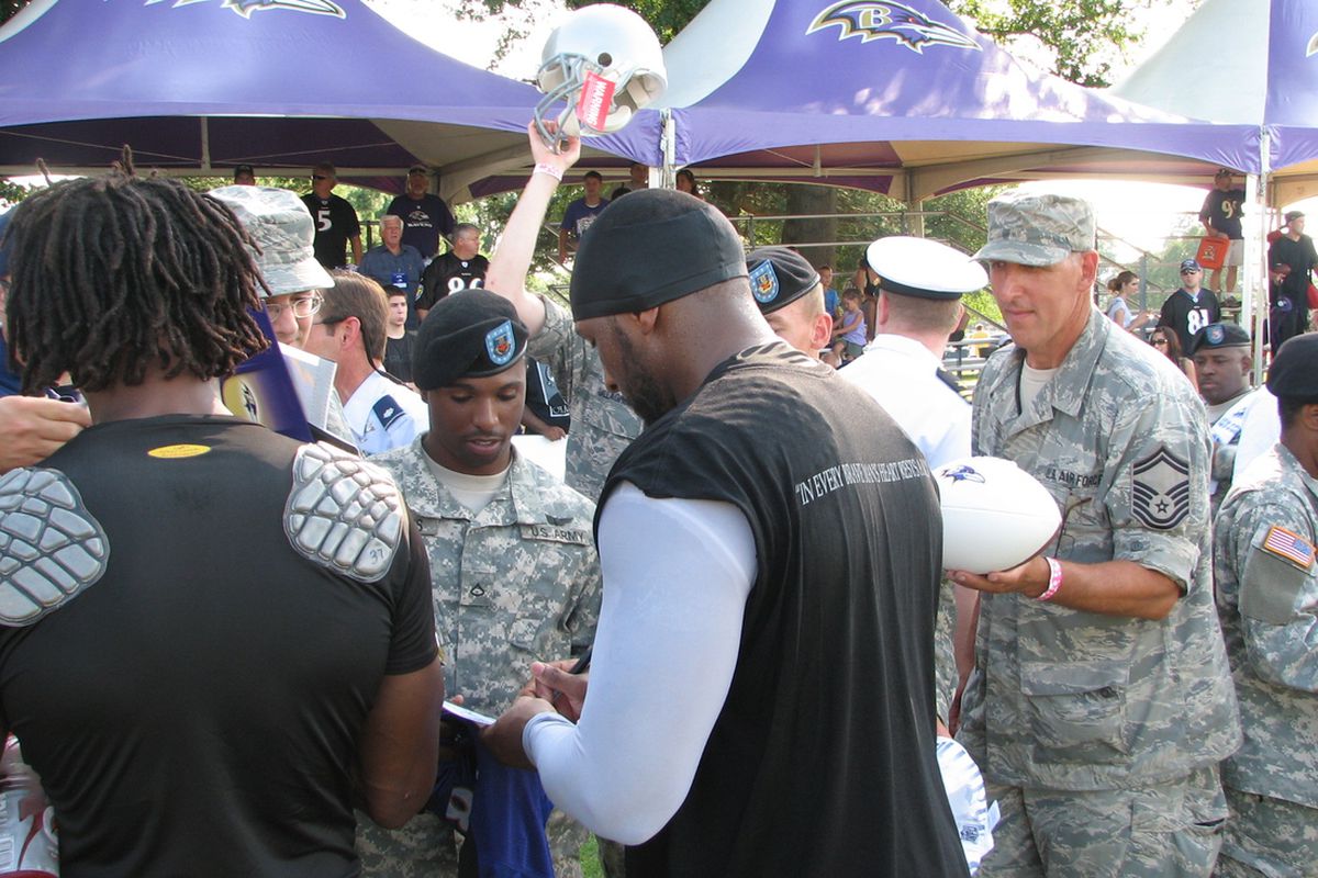 Ravens Lewis signs autographs during Military Appreciation Day at Training Camp (8/17/10)