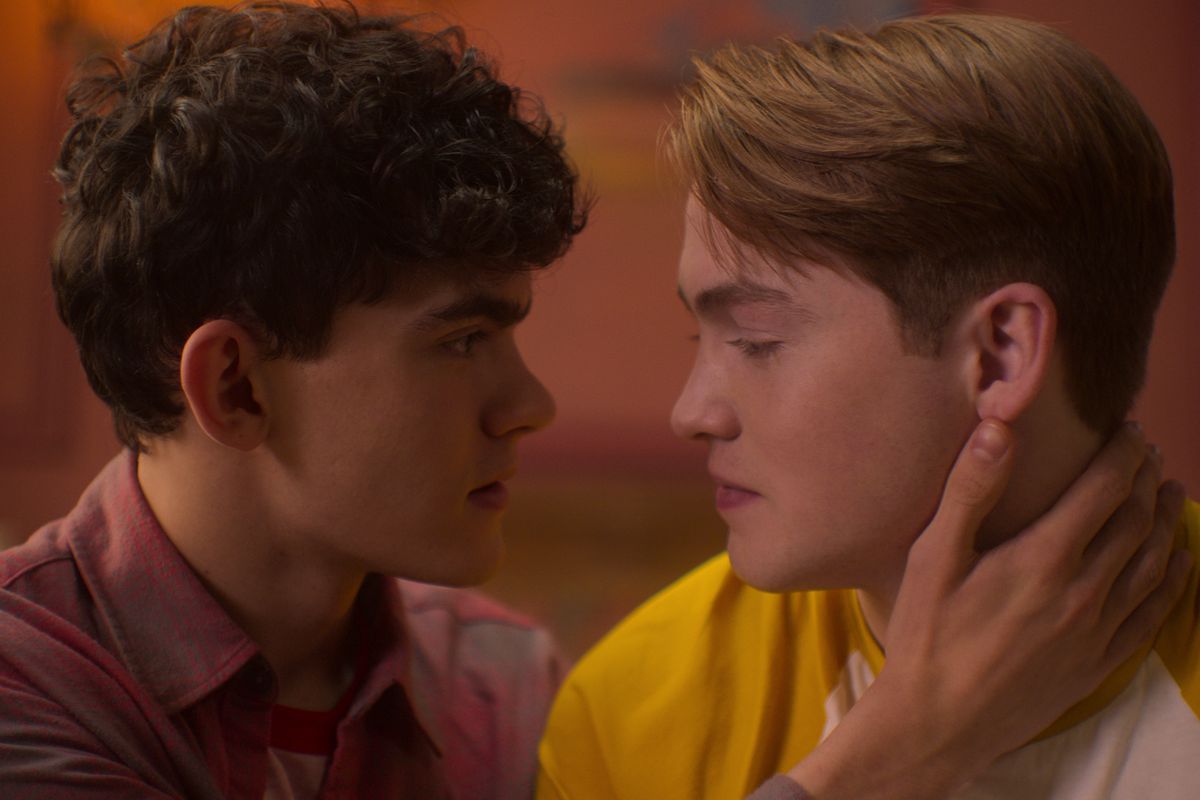 Charlie (Joe Locke) and Nick (Kit Connor) lean in for a kiss in a still from Heartstopper season 2