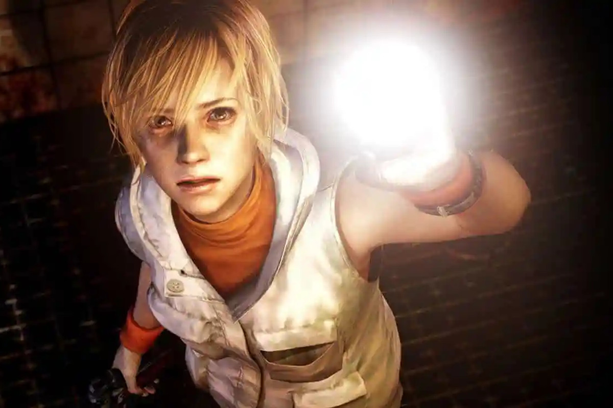 Silent Hill 3 - Cheryl Mason shines her flashlight into the camera. She is a young woman with messy blonde hair in a white vest and orange top. She looks disturbed and on edge.