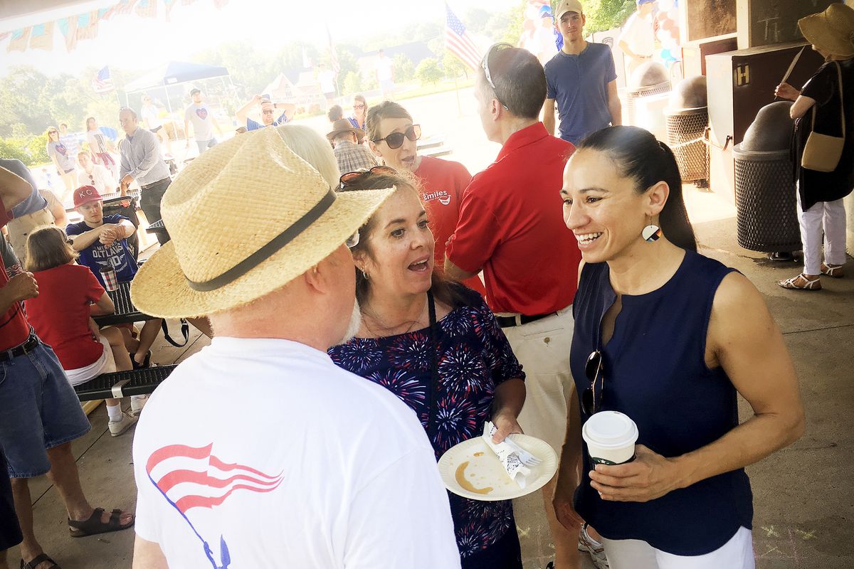 Sharice Davids, a Democrat running for Congress in Kansas, talks to supporters at a July 4 event in Prairie Village.