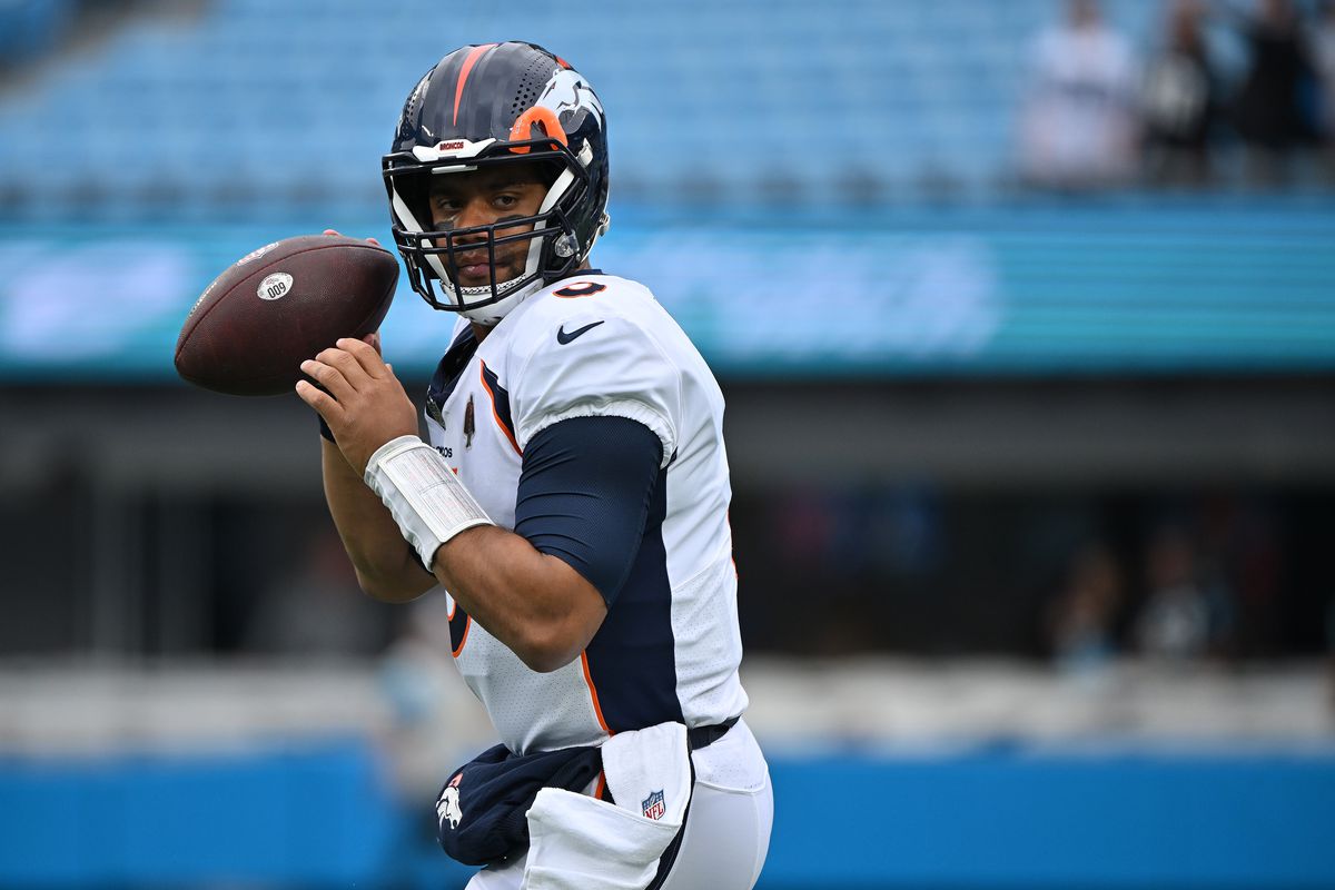Russell Wilson #3 of the Denver Broncos warms up during their game against the Carolina Panthers at Bank of America Stadium on November 27, 2022 in Charlotte, North Carolina.