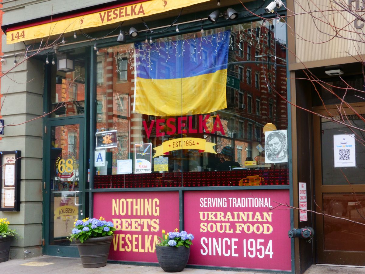 Entrance of Veselka Ukrainian Restaurant with large Ukrainian flag in window, Second Avenue, New York City
