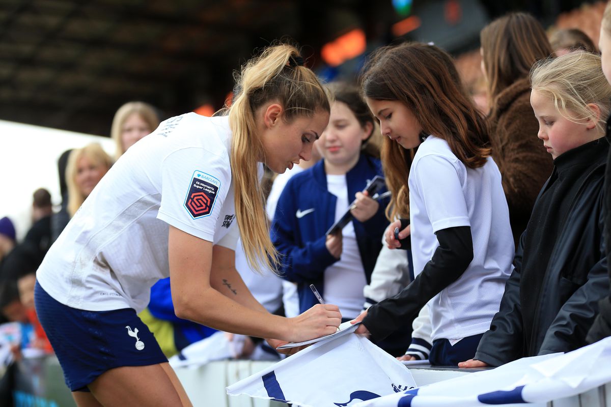 Shelina Zadorsky signs a young supporter’s shirt during Tottenham Hotspur Women v Manchester City Women in the Barclays FA Women’s Super League